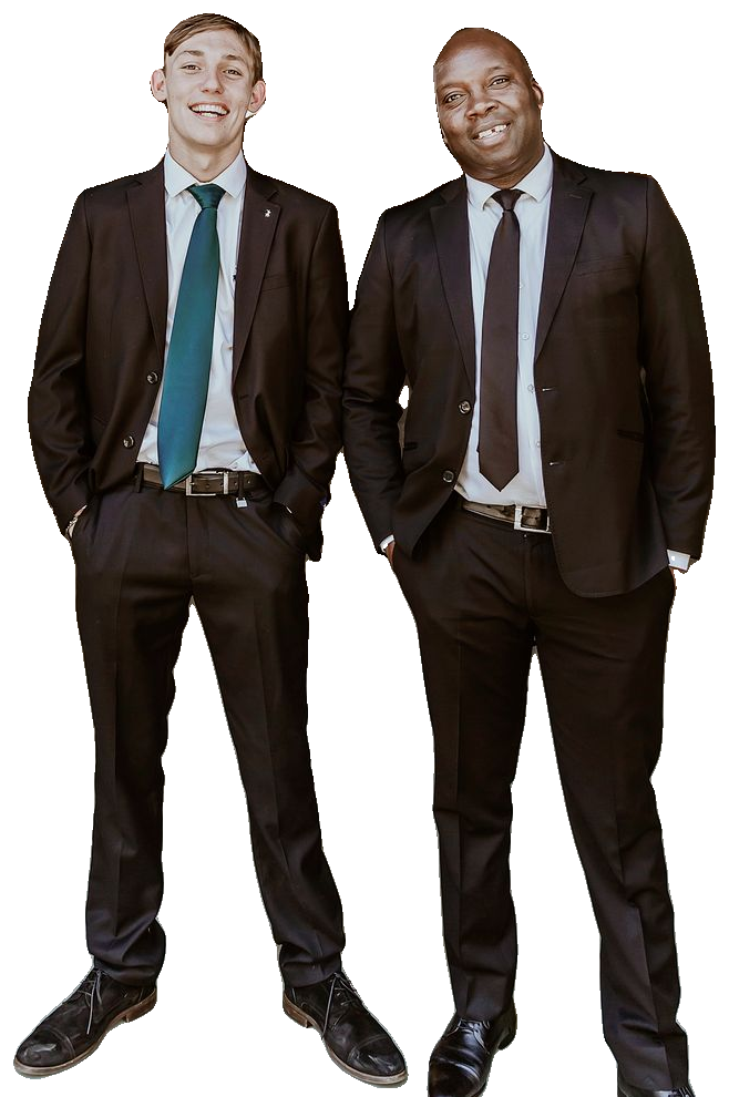 Two men in dark suits standing side by side, smiling at the camera. A stand-in photo until the founders' own portrait is taken.