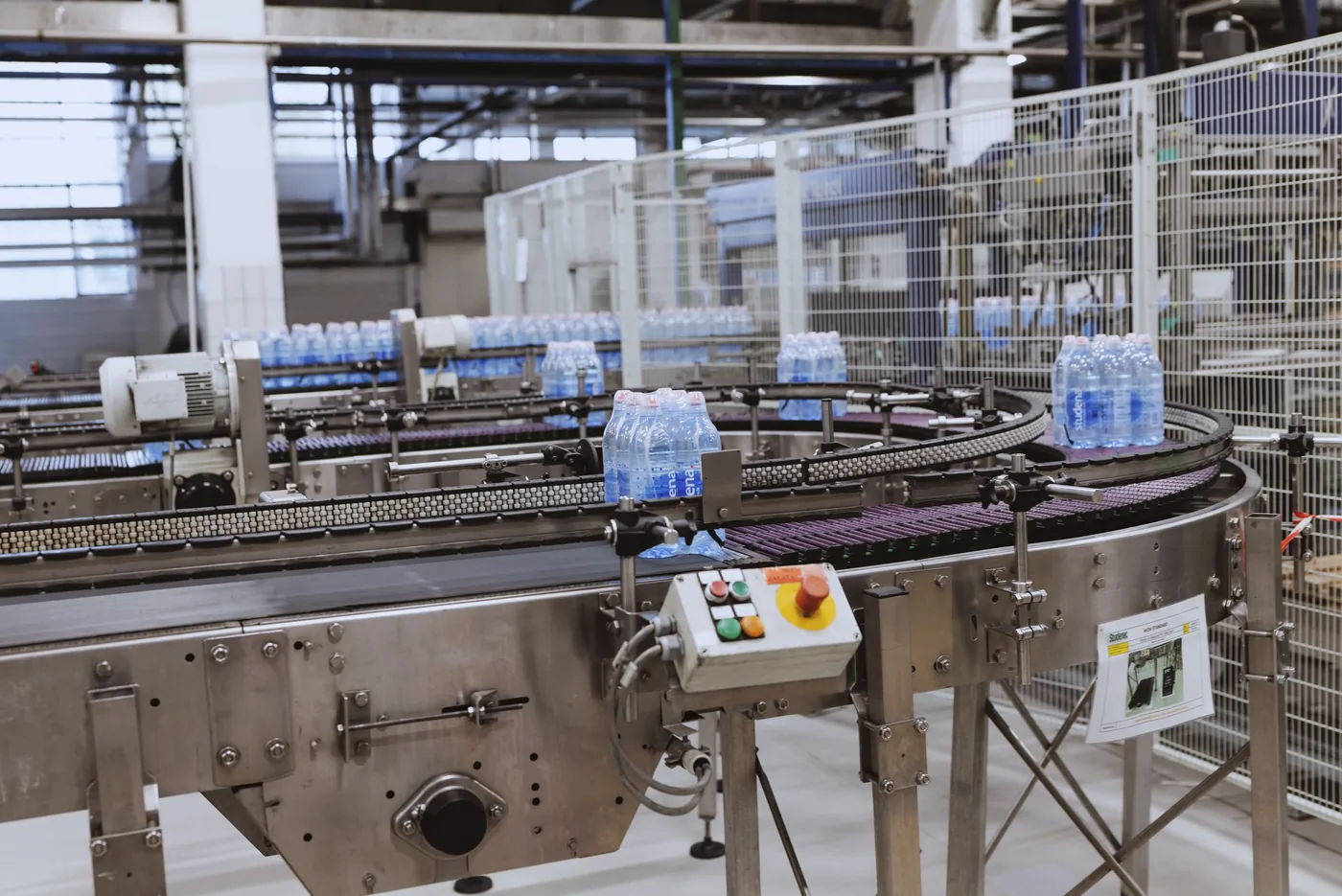 A beverage bottling line running in a cool-lit EU plant