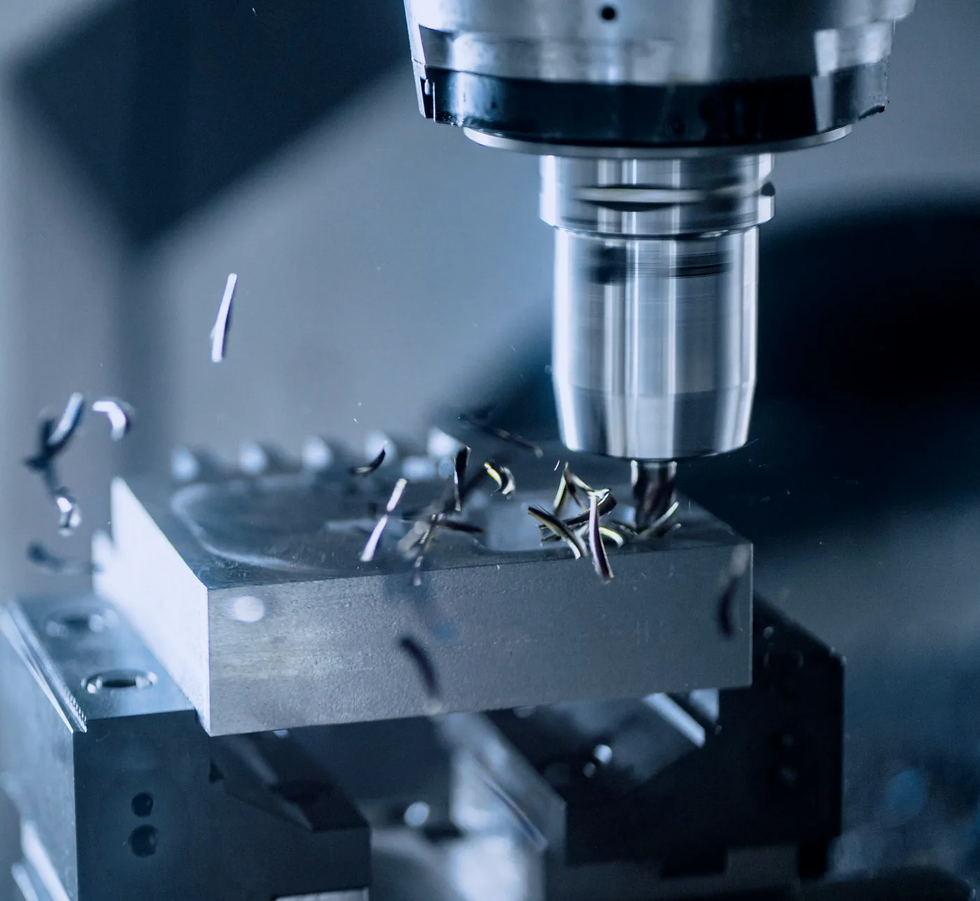 A CNC machining centre cutting metal in a precision workshop